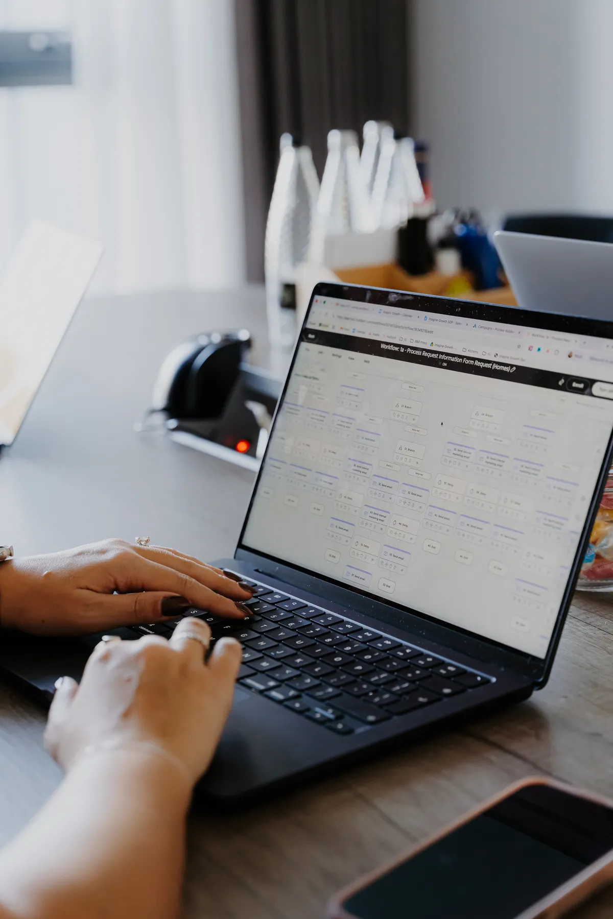 Hands on a laptop showing a dashboard