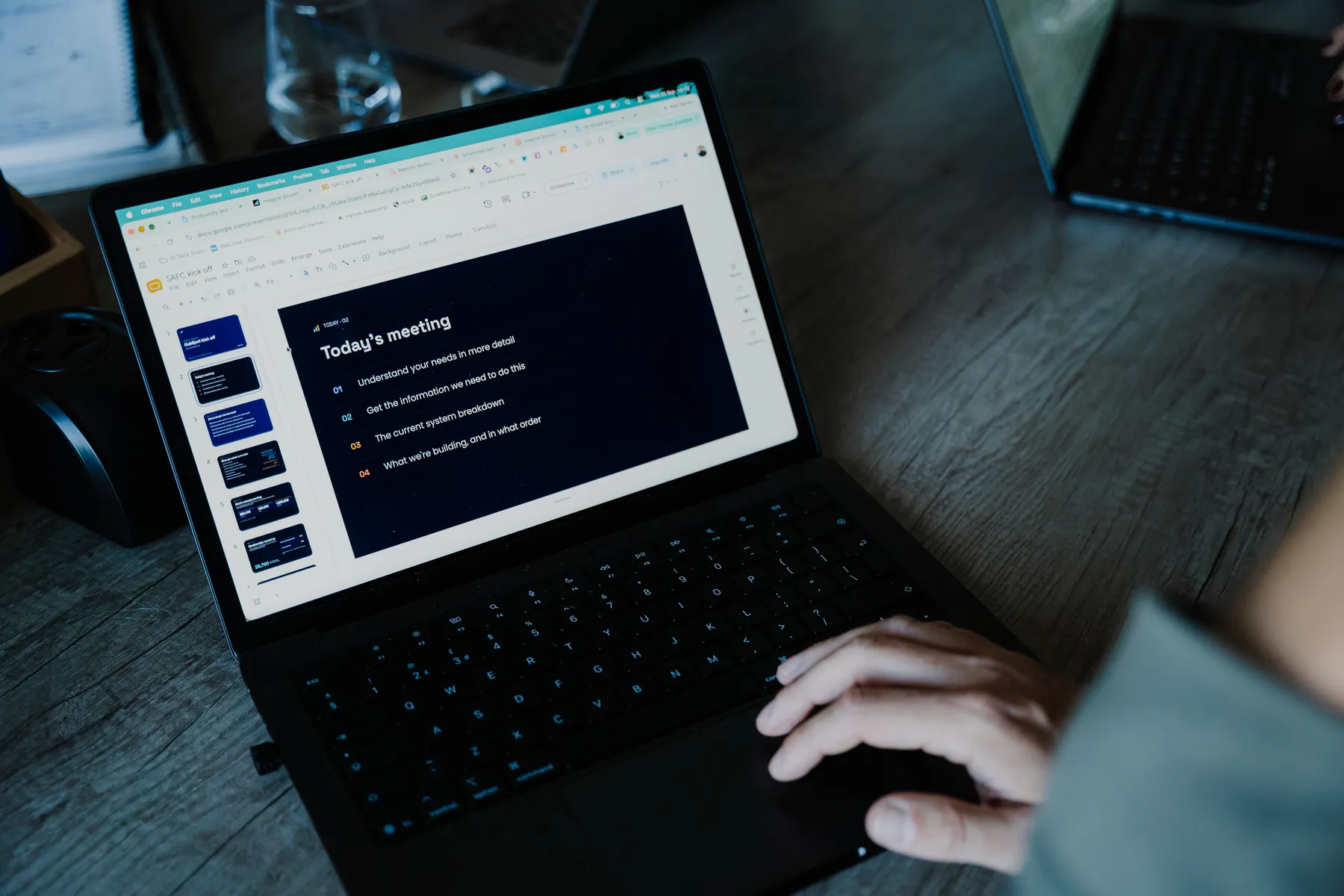 A meeting agenda on a laptop screen