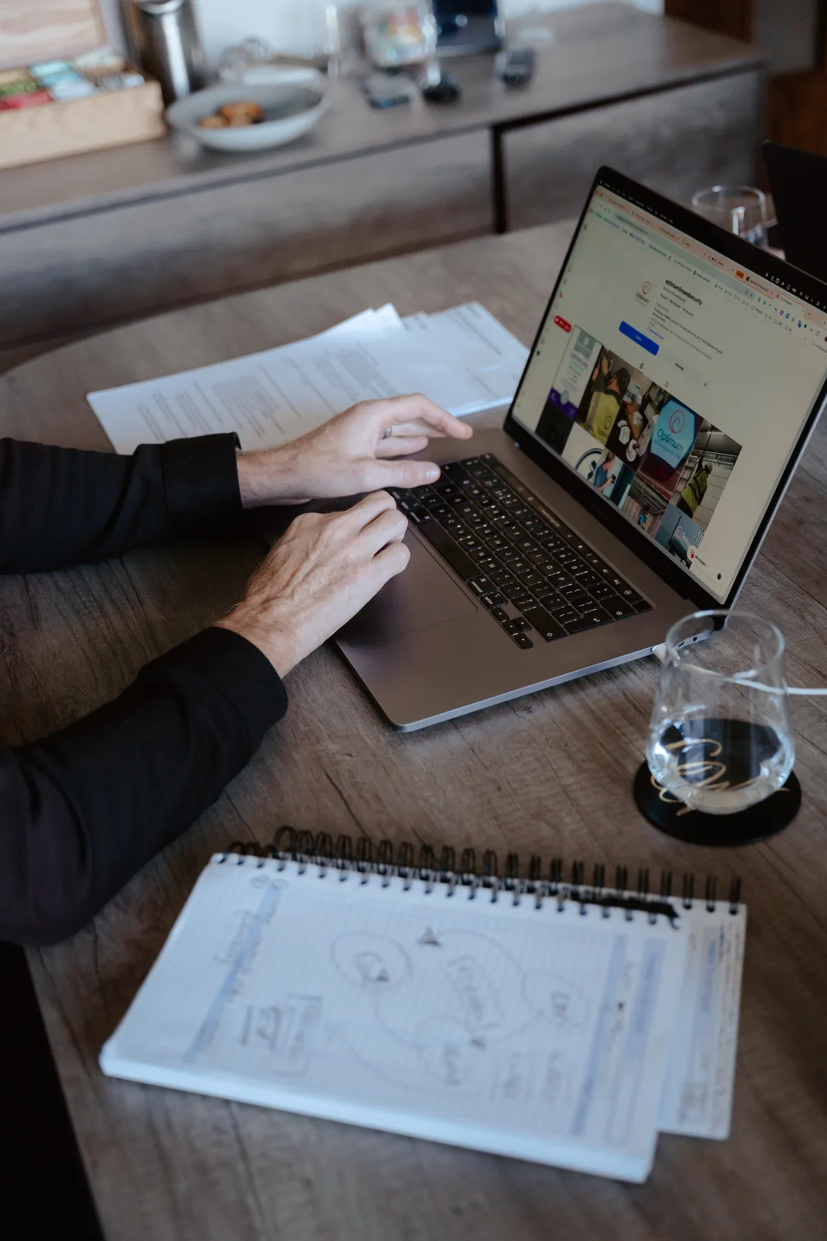 A laptop and notebook on the table, mid audit review